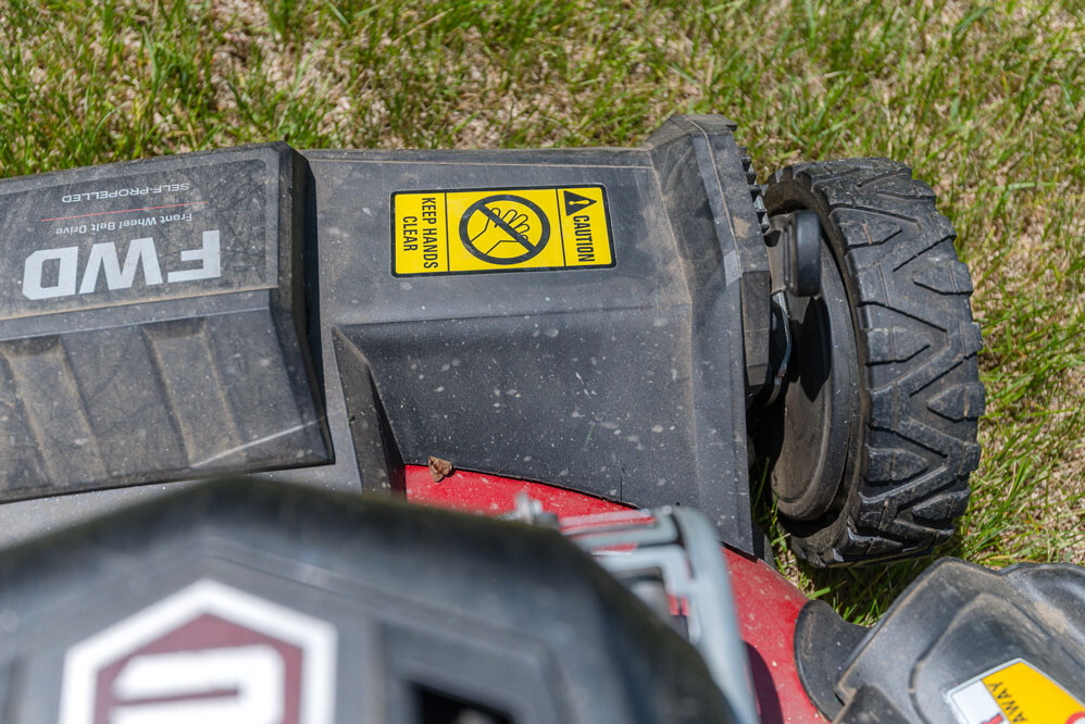 lawn mower closeup with industrial sticker